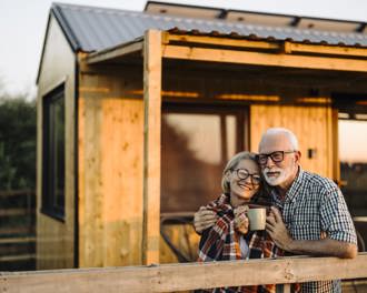 Senior couple cabin patio evening
