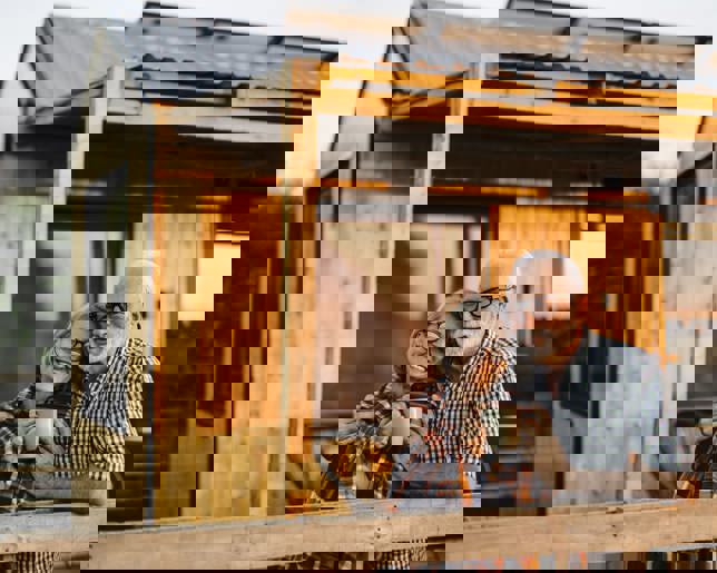 Senior couple cabin patio evening