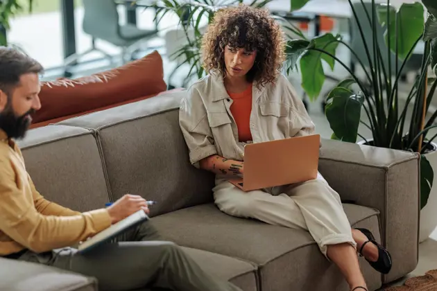 A claims adviser speaking to an insurance client