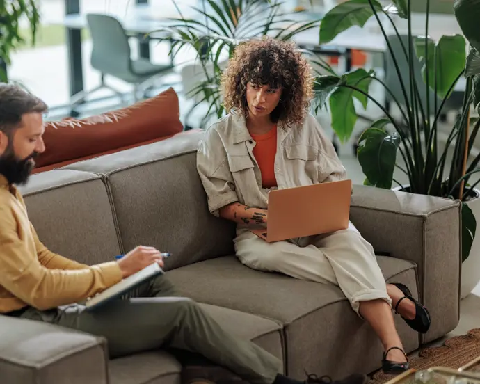 A claims adviser speaking to an insurance client