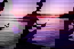 Meditating by peaceful sea