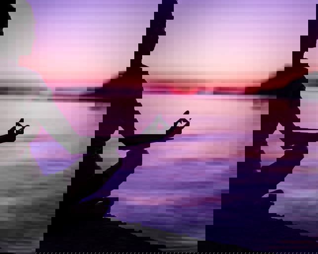 Meditating by peaceful sea