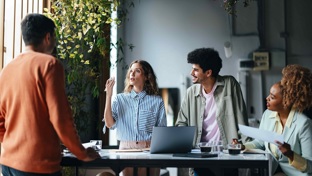 A group of men and women in a business meeting