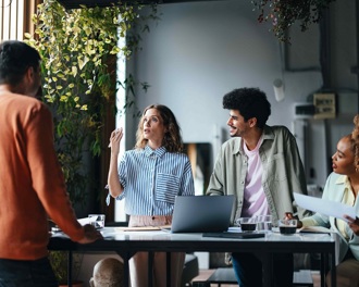 A group of men and women in a business meeting