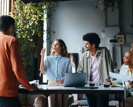 A group of men and women in a business meeting
