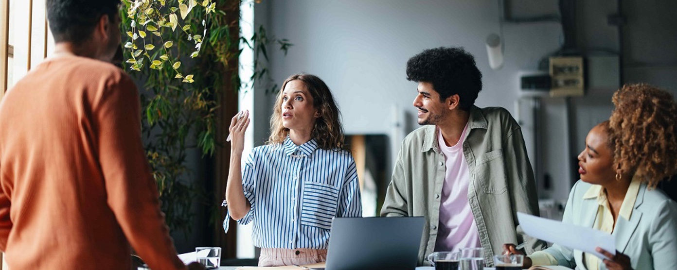 A group of men and women in a business meeting