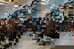 Hairdressers serving clients 