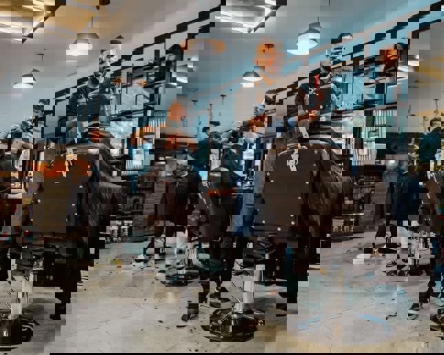 Hairdressers serving clients 