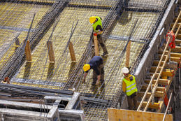 Workers making reinforced concrete molds