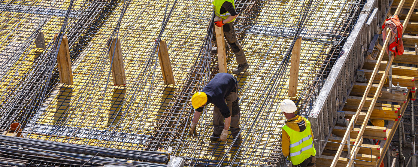 Workers making reinforced concrete molds