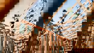 Construction Crew Framing of New Home