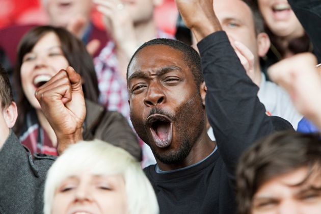 Male supporting a team