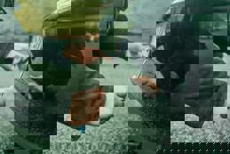 Removing license plate from vehicle.