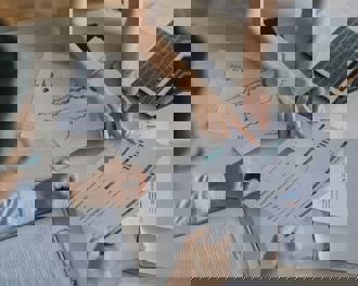 High angle Asian businesswoman working with her coworker 