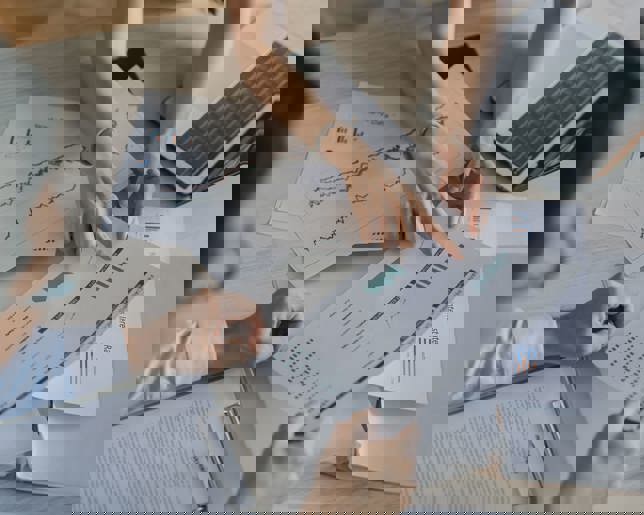 High angle Asian businesswoman working with her coworker 