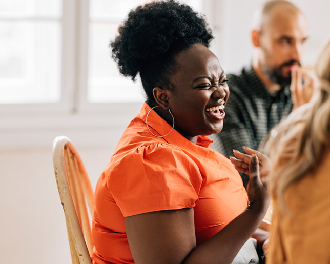 A smiling colleague in an induction session at work
