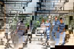 Hospital corridor staff and patients