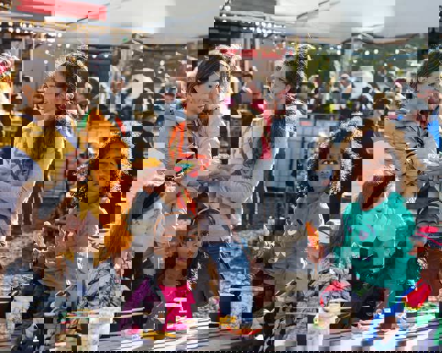 Two families enjoying a day out at a family friendly halloween fright festival