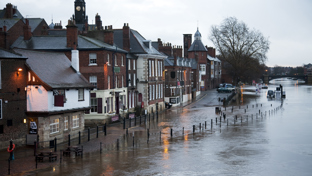 Aerial view of a flooded residential area with water covering streets