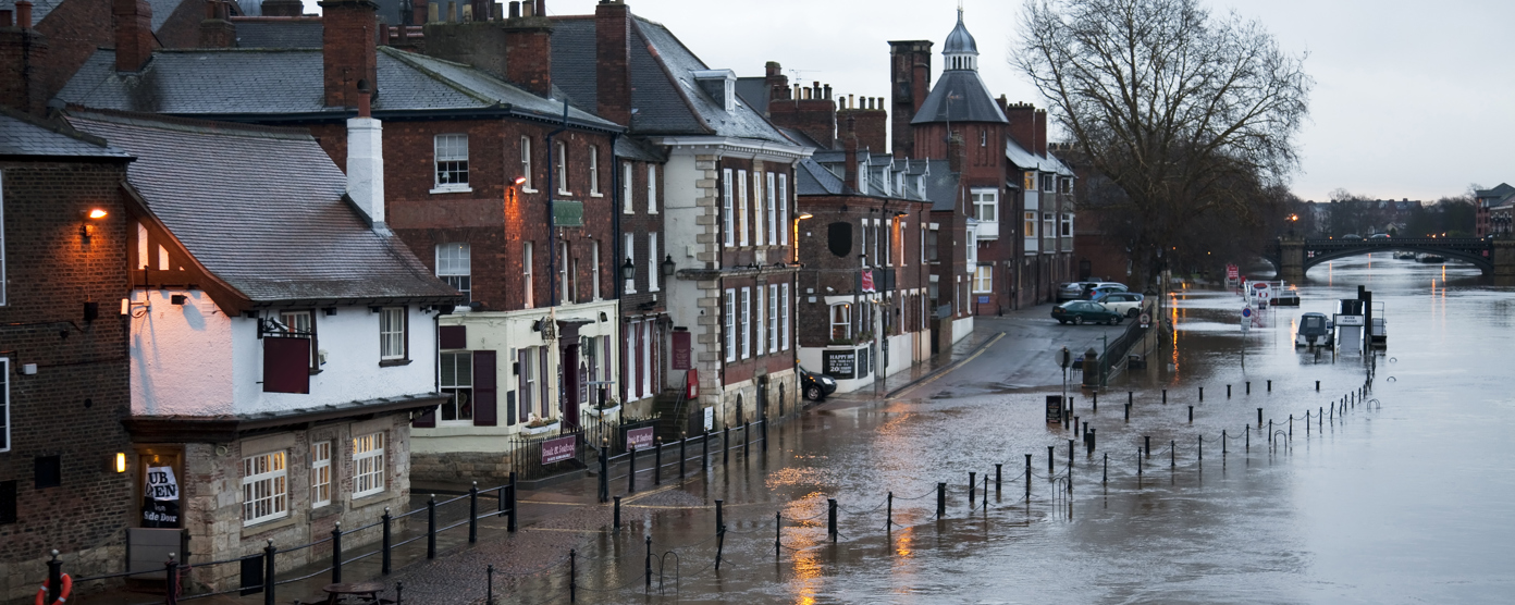 Aerial view of a flooded residential area with water covering streets
