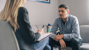 Guide to care home insurance illustrated by a caring senior setting with supportive staff and a reassuring professional tone