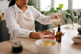 Pouring essential oil into bottle