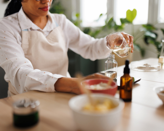 Pouring essential oil into bottle