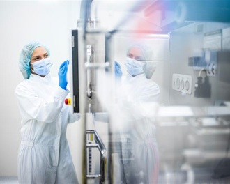 Clinician in a mask and scrubs