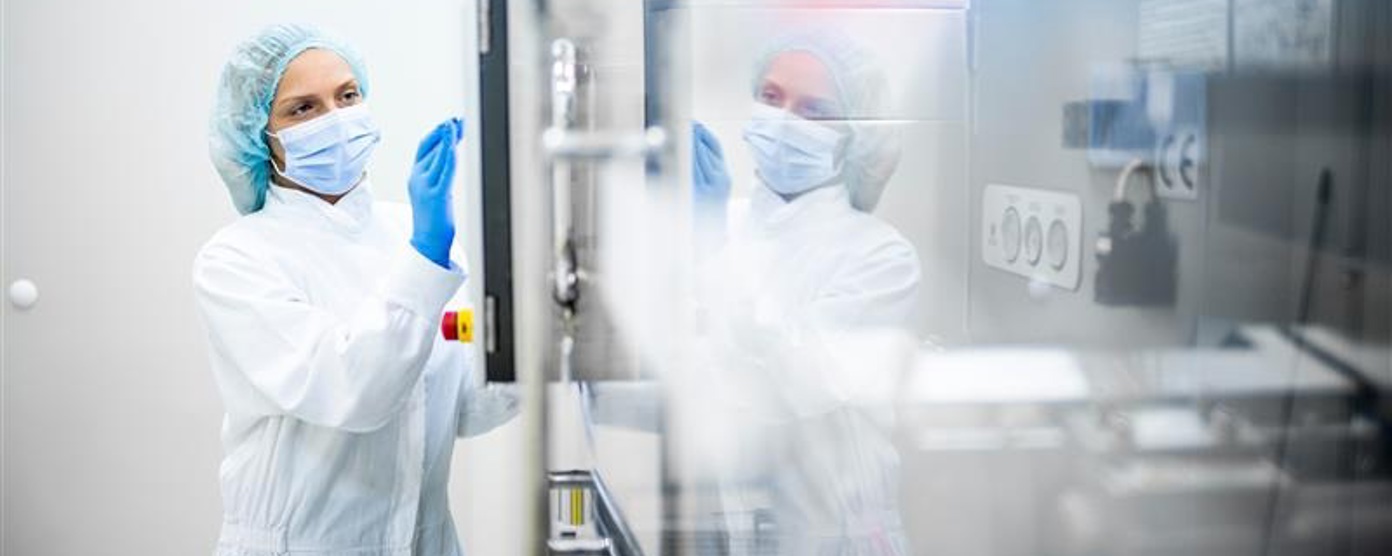 Clinician in a mask and scrubs