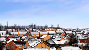 housing-estate-snow-dusted-rooftops-of-detached-and-semis.jpg