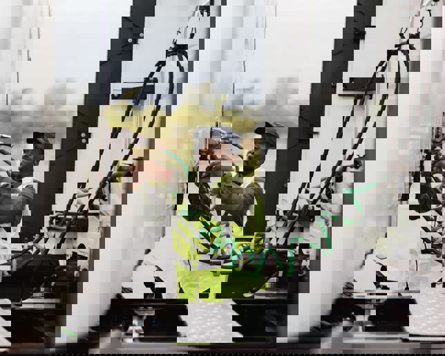 Truck driver connecting refrigerated trailer