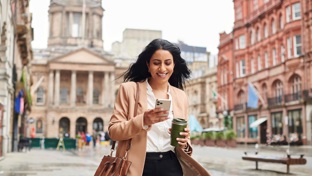Businesswoman walking through a city