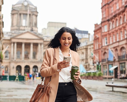 Businesswoman walking through a city