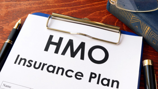 Home insurance plan document with fountain pen