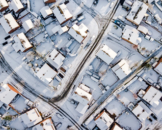 header-drone-view-of-housing-estate-in-the-snow.jpg