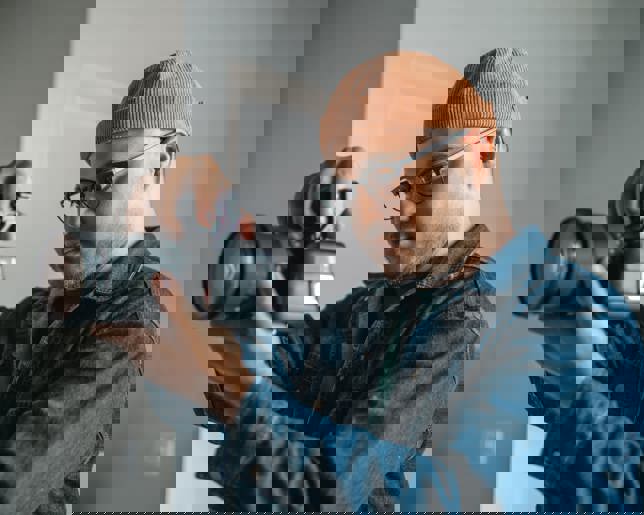 Professional photographer shooting model in studio