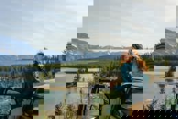 Woman looking at lake banff road trip