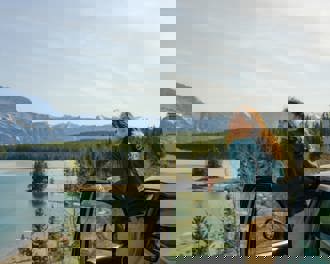 Woman looking at lake banff road trip