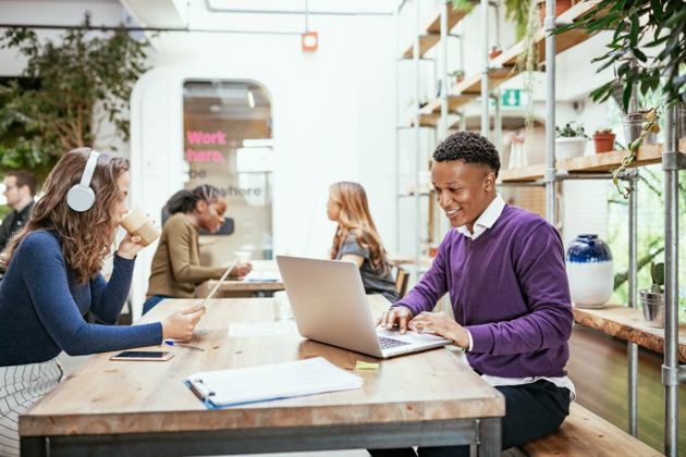 Employees working individually on a table