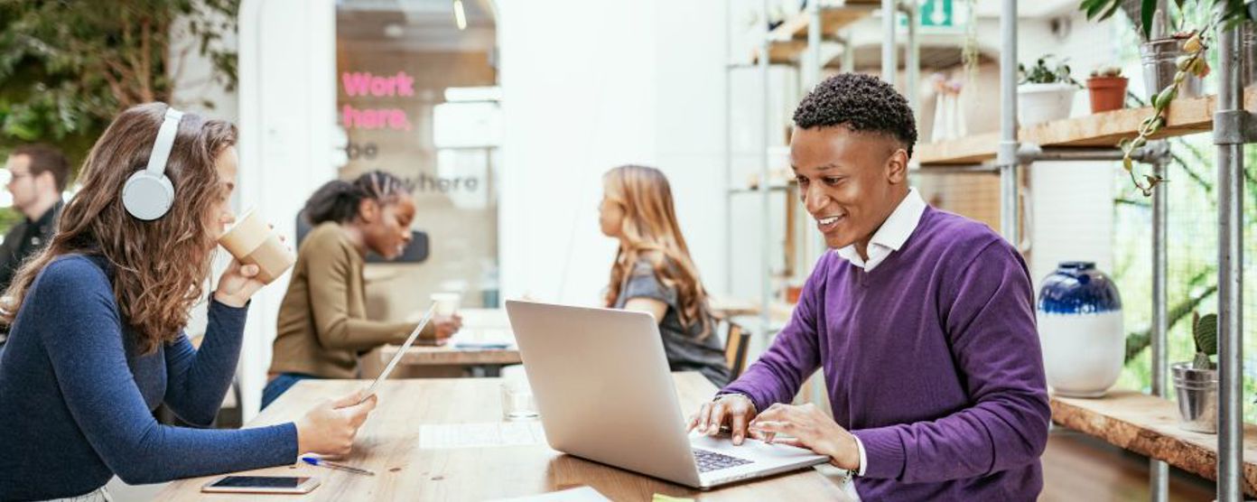 Employees working individually on a table