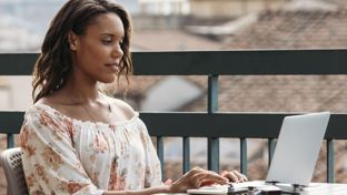 Female working on her work laptop outside.jpg