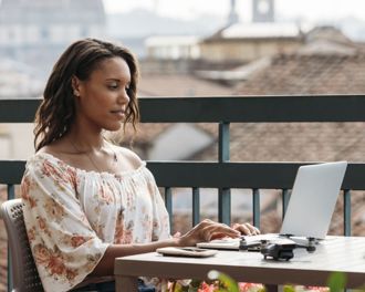 Female working on her work laptop outside.jpg