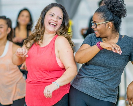 Women laughing at a keep fit class
