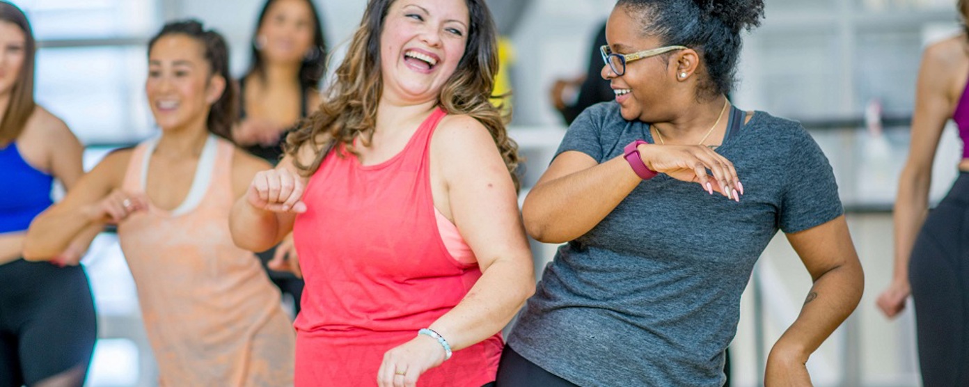 Women laughing at a keep fit class
