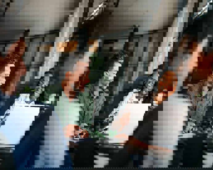 Colleagues laughing during a meeting.jpg (1)