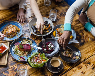 Friends dining in restaurant