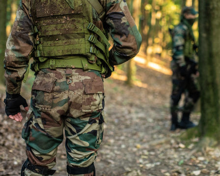 Army man walking in forest