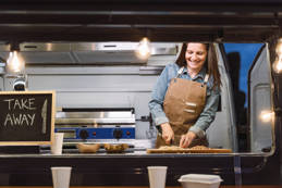 Food truck owner preparing meal