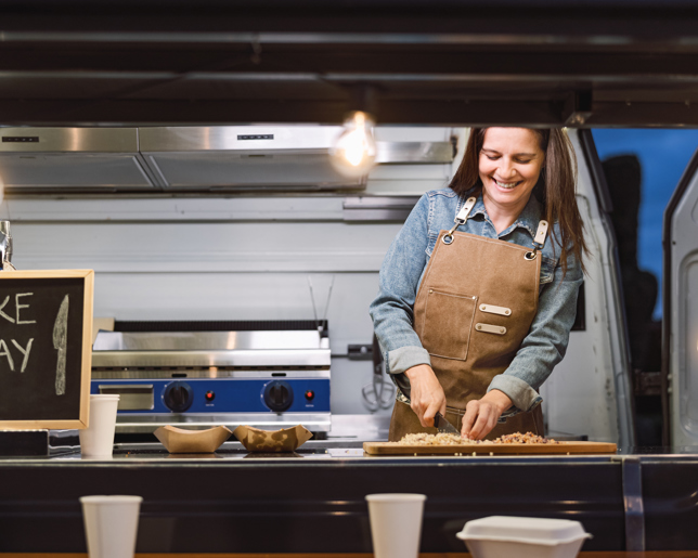 Food truck owner preparing meal