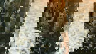 Soldier in military kit performing tasks